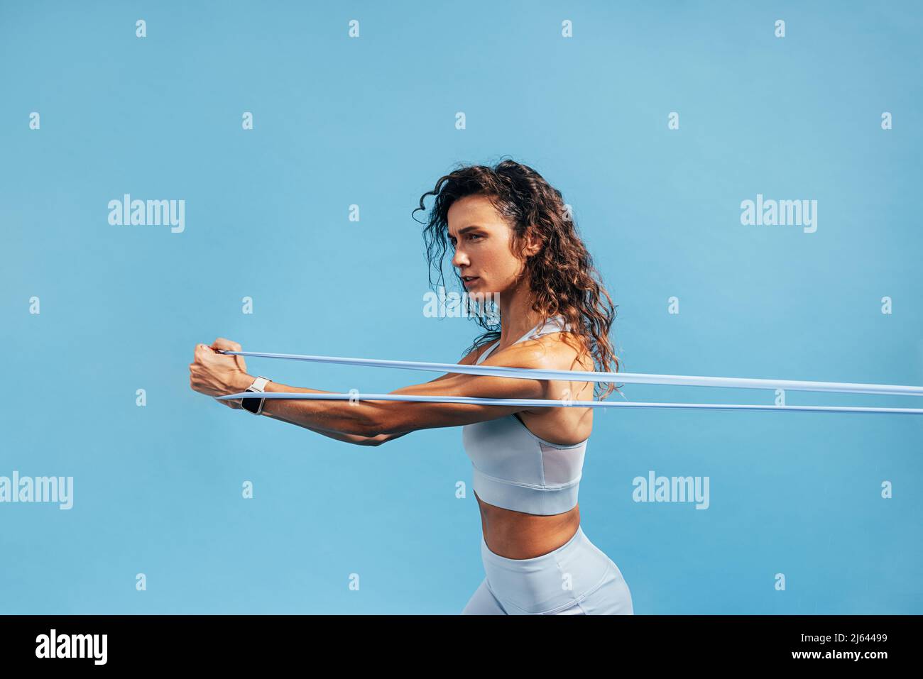 Young Caucasian Woman Using a Resistance Rubber Band To Tone Her Back Stock  Photo - Image of energy, endurance: 154529780