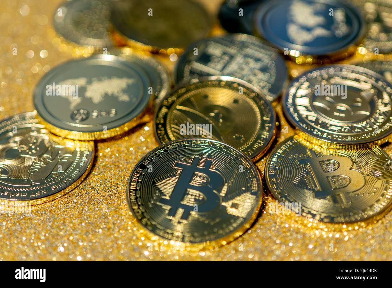 Golden crypto coins on a gold background. Bitcoin cryptocurrency with  altcoins and shitcoins. High quality photo Stock Photo - Alamy