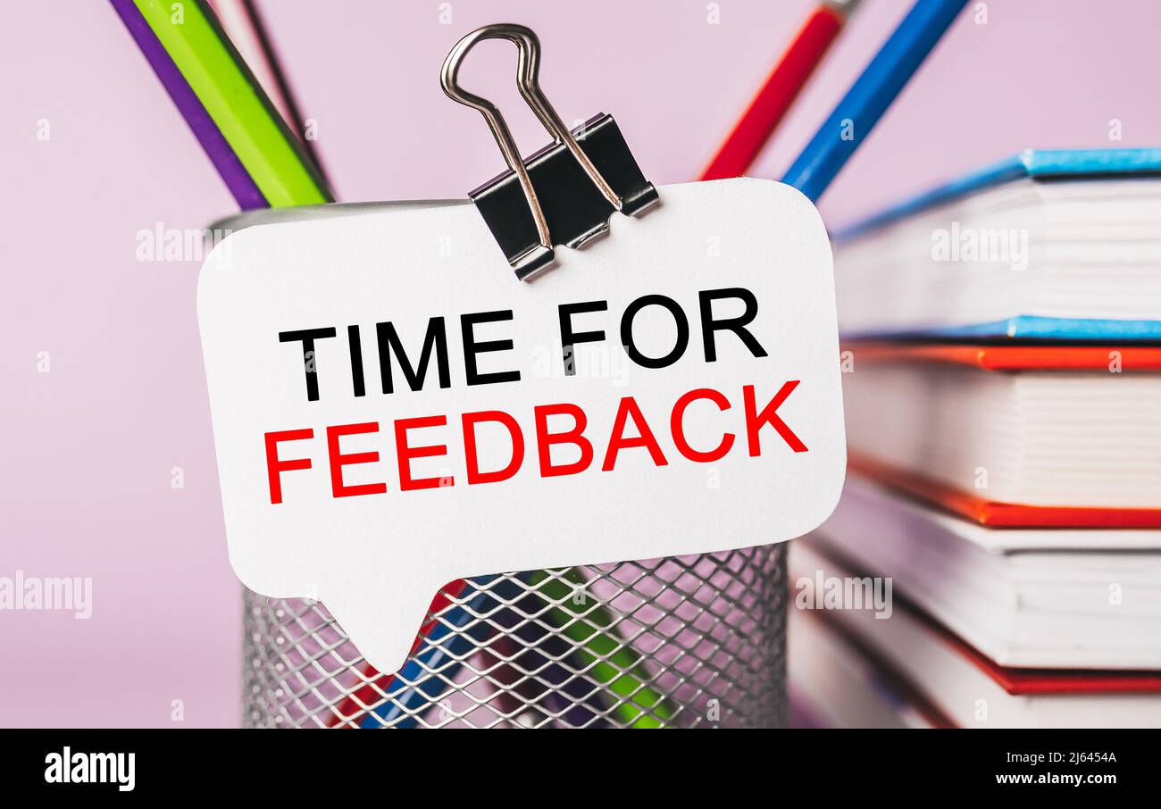 Text Time for Feedback on a white sticker with office stationery background. Flat lay on business, finance and development concept Stock Photo