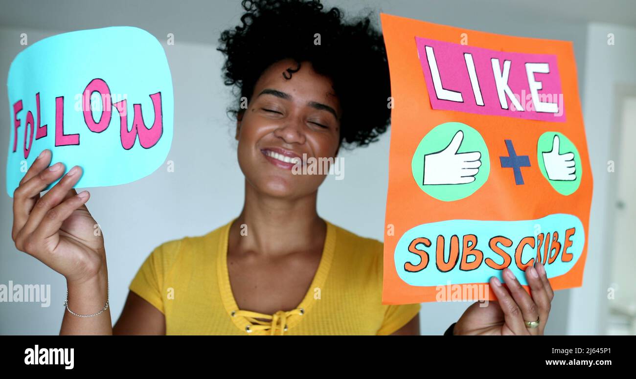 Milinal Sign Millennial African woman showing like and subscribe signs Stock Photo ...