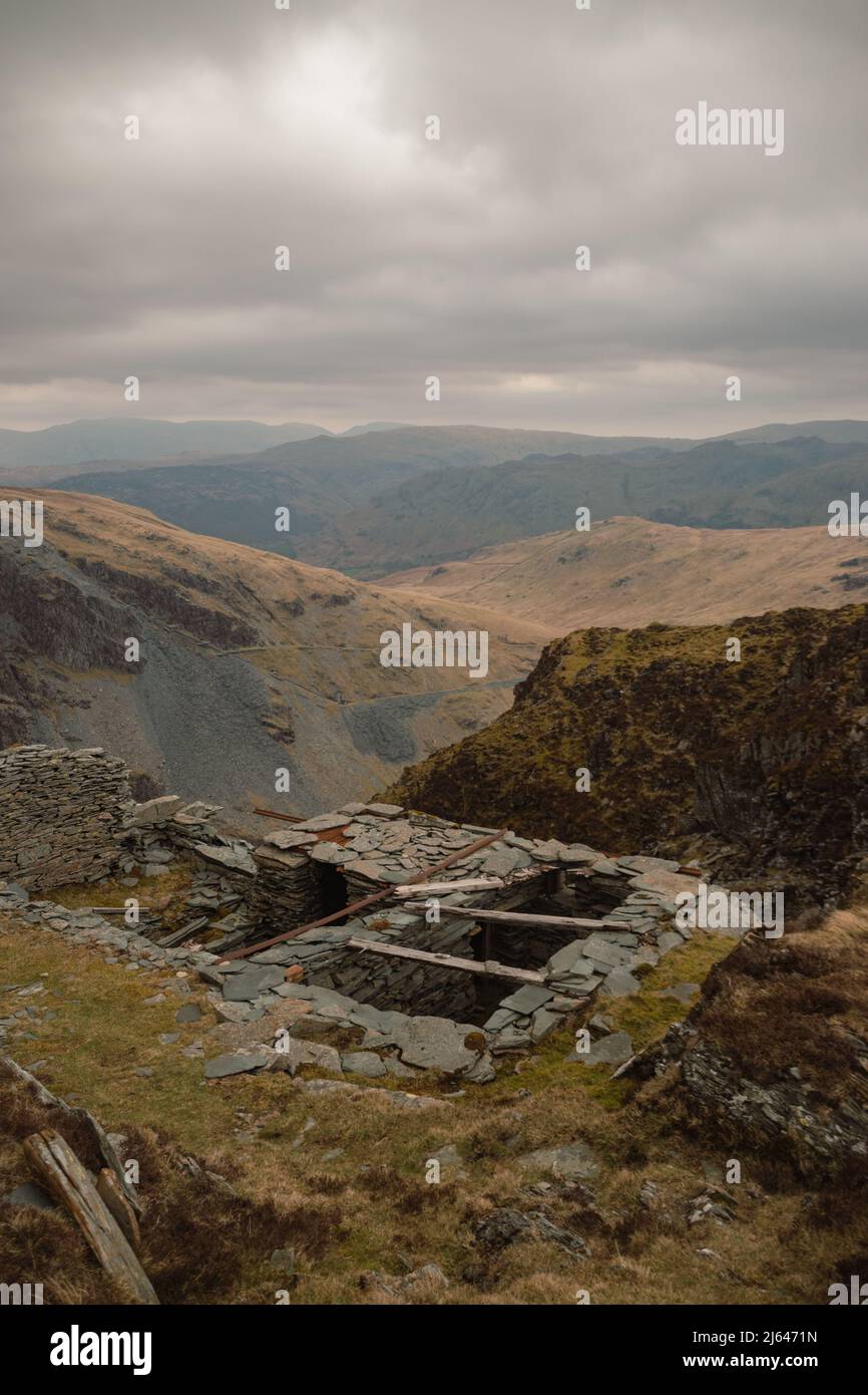 Abandoned Slate building overlooking the Hollister Slate Mine in the Lake District National Park, Cumbria, England, UK. Stock Photo