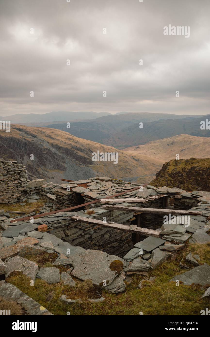 Abandoned Slate building overlooking the Hollister Slate Mine in the Lake District National Park, Cumbria, England, UK. Stock Photo