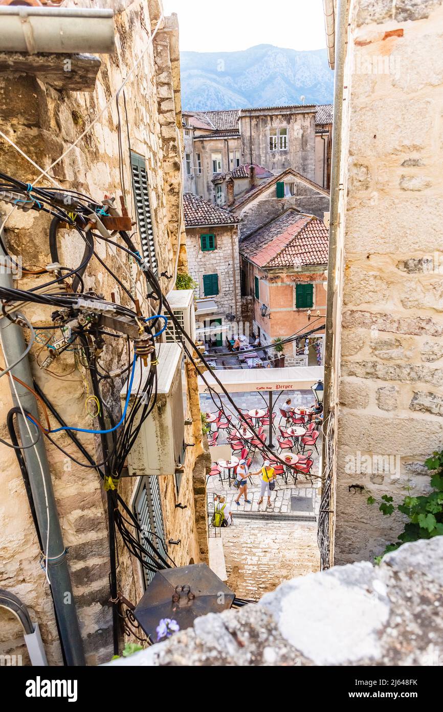 KOTOR, MONTENEGRO - September 16, 2019: Tangled wires and cables between old houses in Kotor city in Montenegro Stock Photo