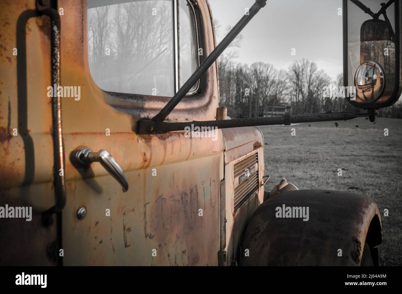 An old abandoned truck sits in a field of grass Stock Photo - Alamy