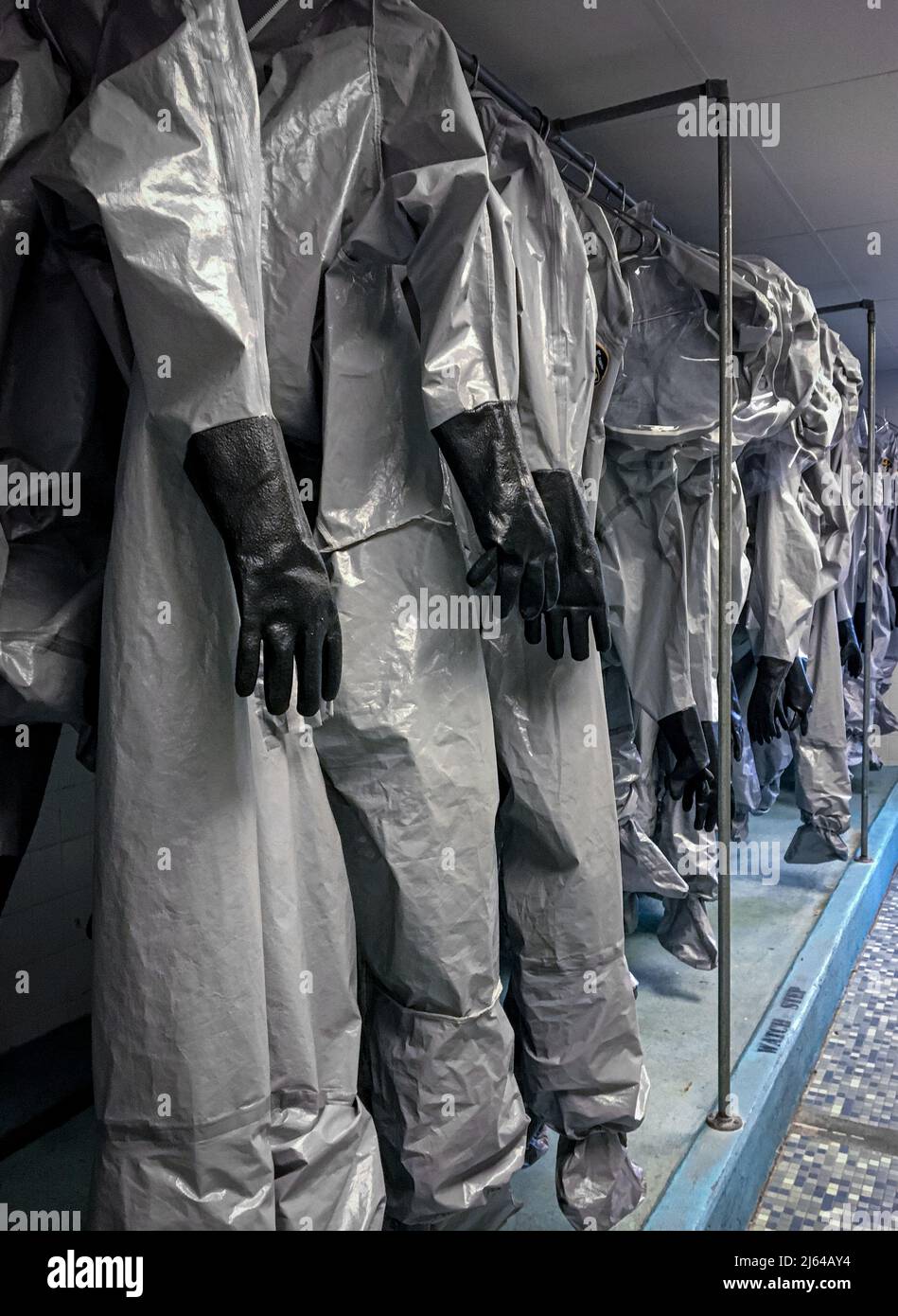 Hazmat suits hanging to dry Stock Photo Alamy