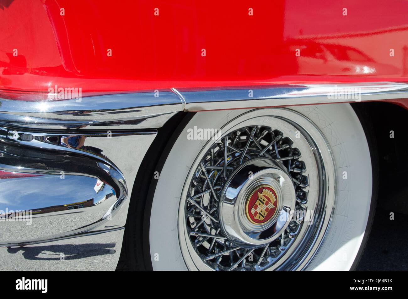 Details and whitewall tires of an old hot red muscle car Stock Photo