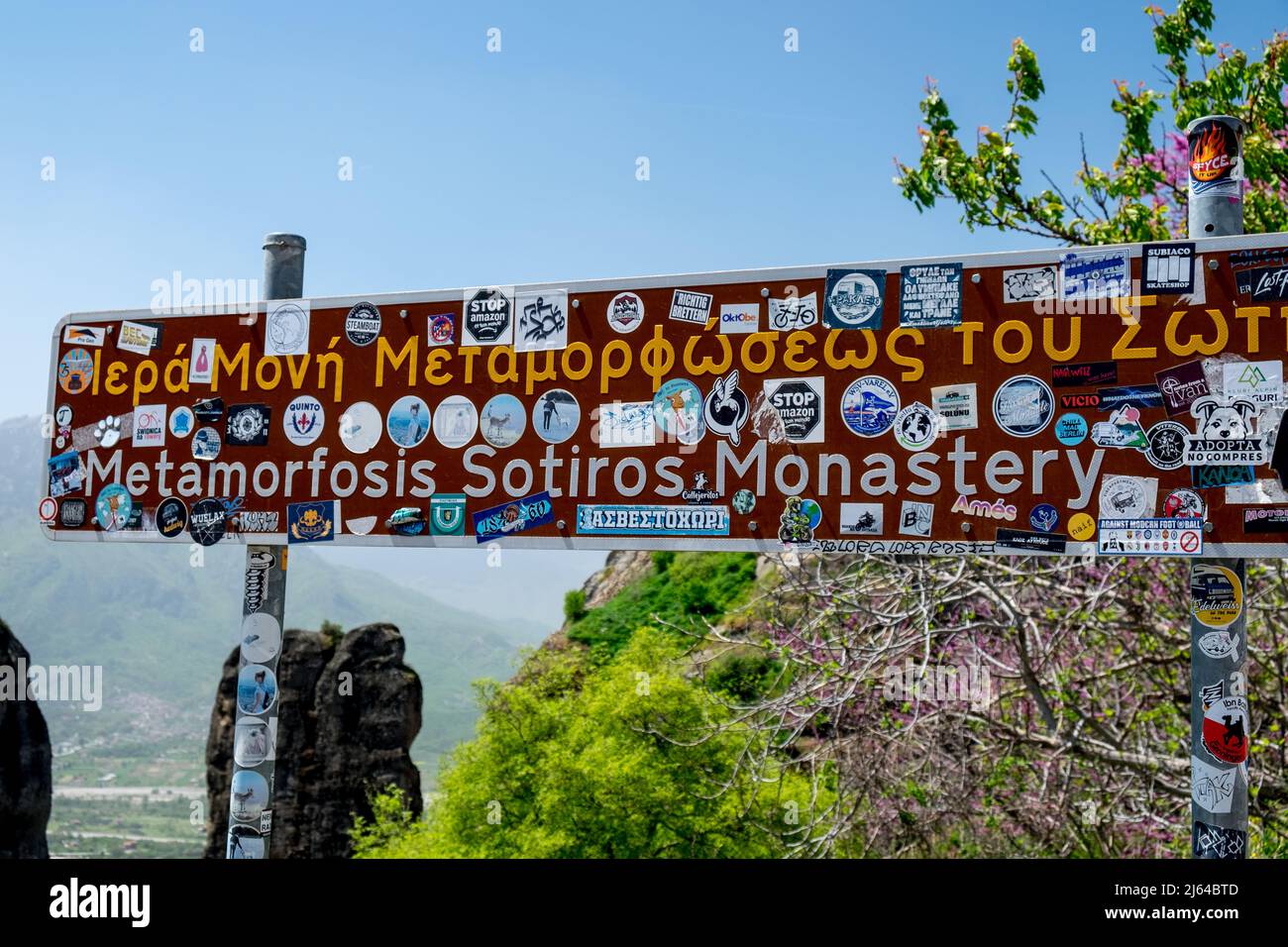 Sign full of stickers of Metamorfosis Sotiros Monastery Meteora , Greece Stock Photo