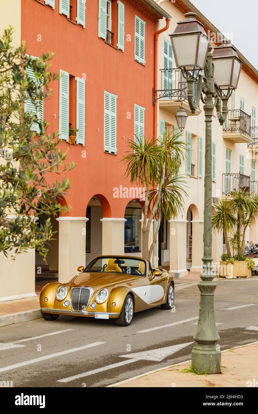 Exclusive vintage car is standing on narrow small streets, replica on