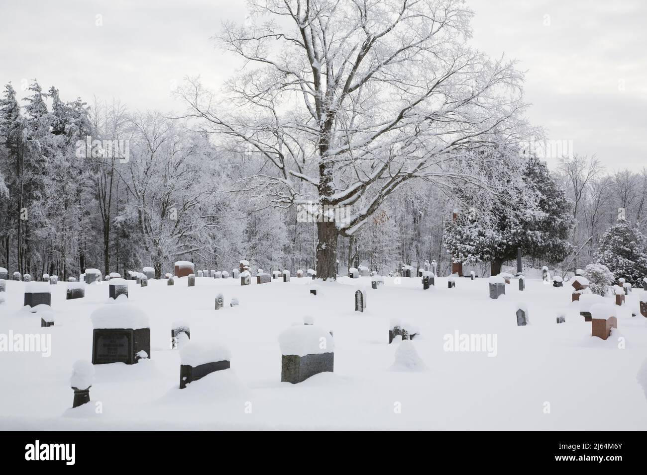 Cemetery in winter, Knowlton, Eastern Townships, Quebec, Canada. Stock Photo