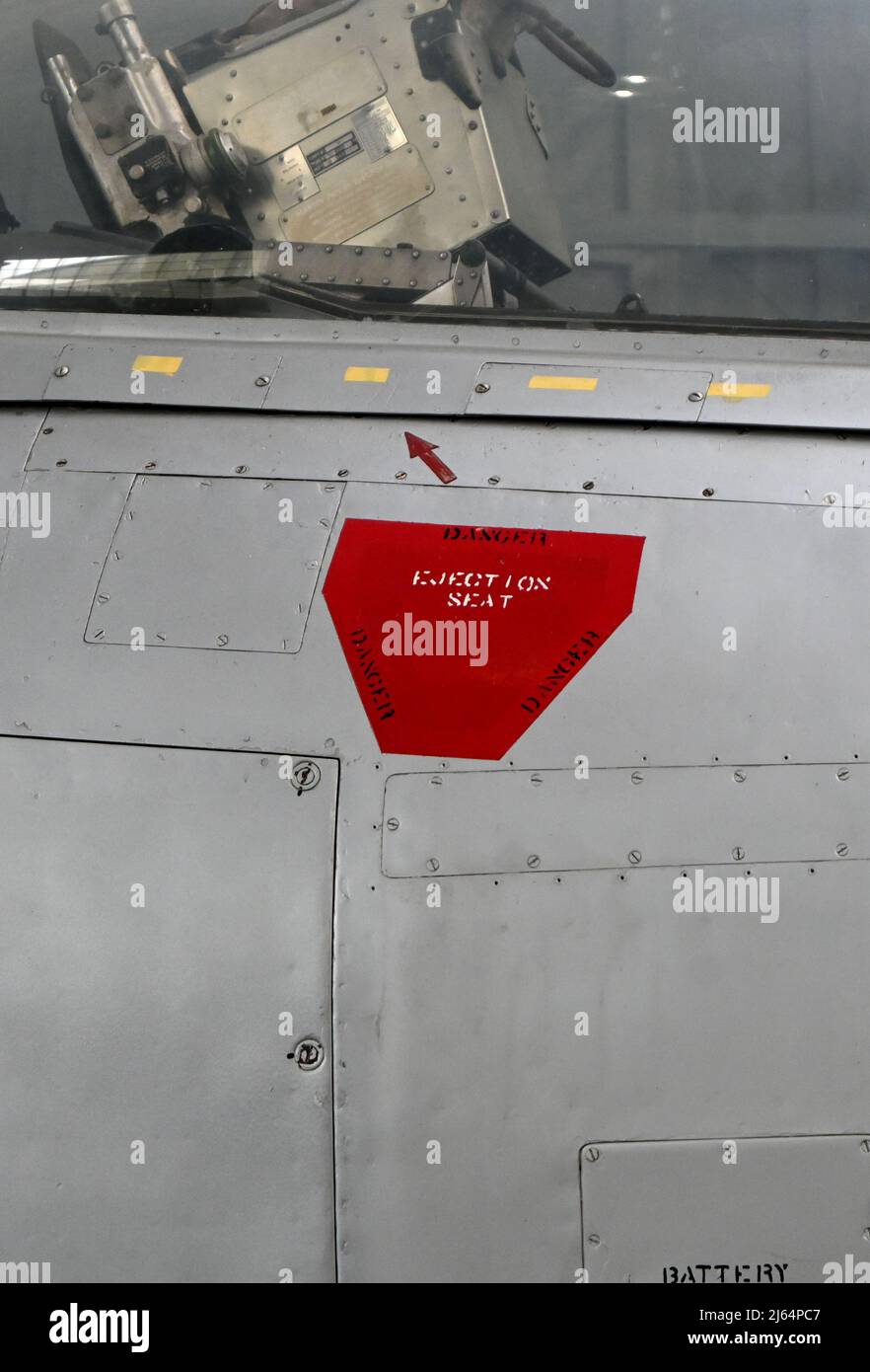 close up of Metal surface of  aircraft fuselage with rivets with ejection seat sign Stock Photo