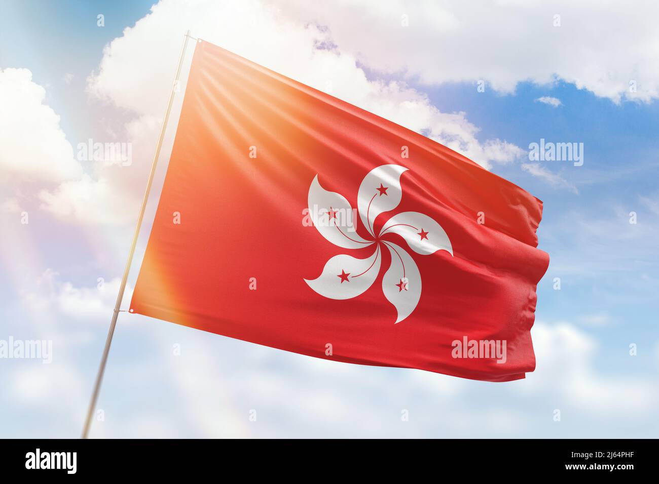 Sunny blue sky and a flagpole with the flag of hong kong Stock Photo