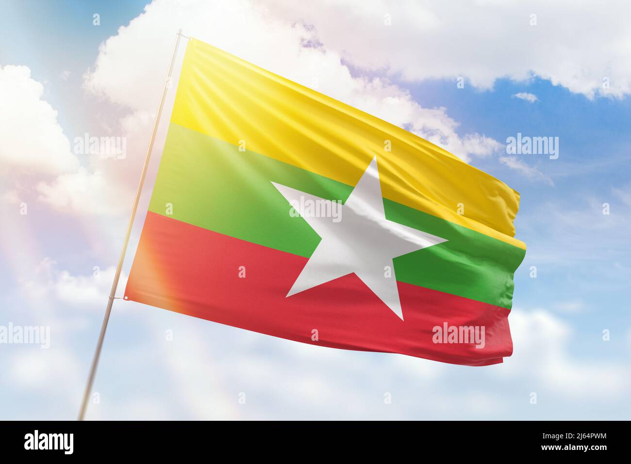 Sunny blue sky and a flagpole with the flag of myanmar Stock Photo - Alamy