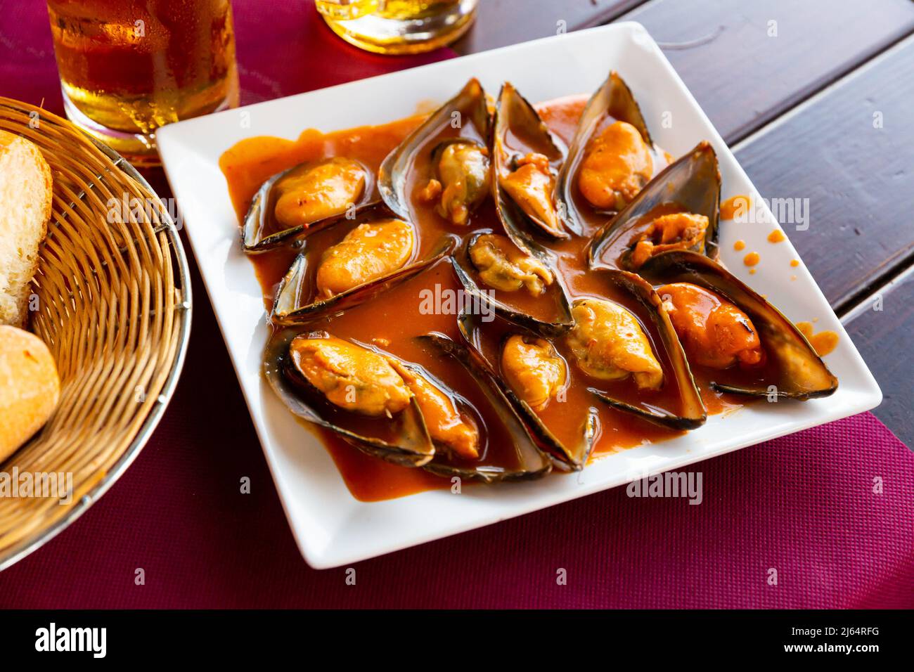 Mussels served with red sauce Stock Photo Alamy