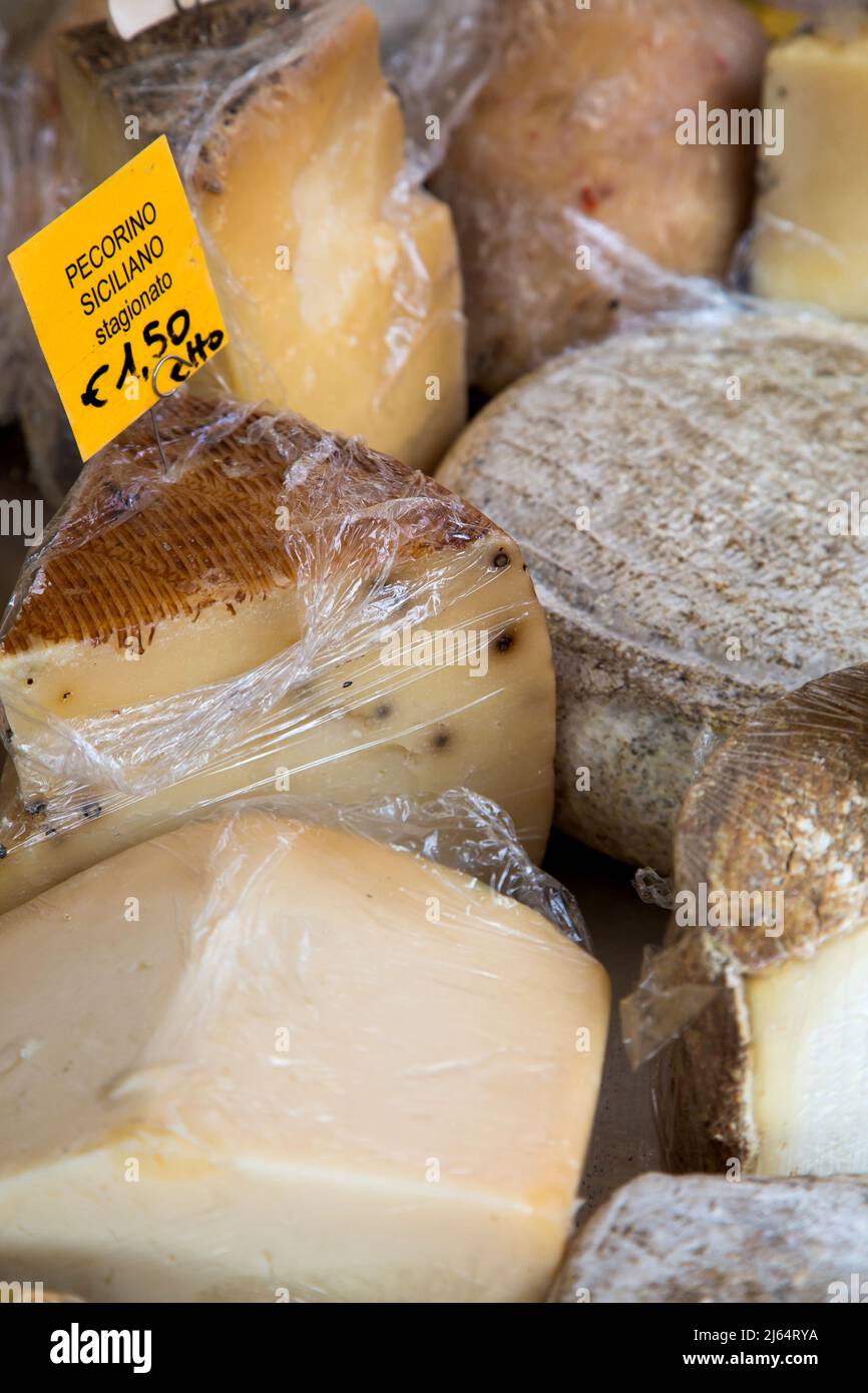 A variety of cheeses on display at the Saturday moring market in Alba in the Piedmont region of Italy Stock Photo