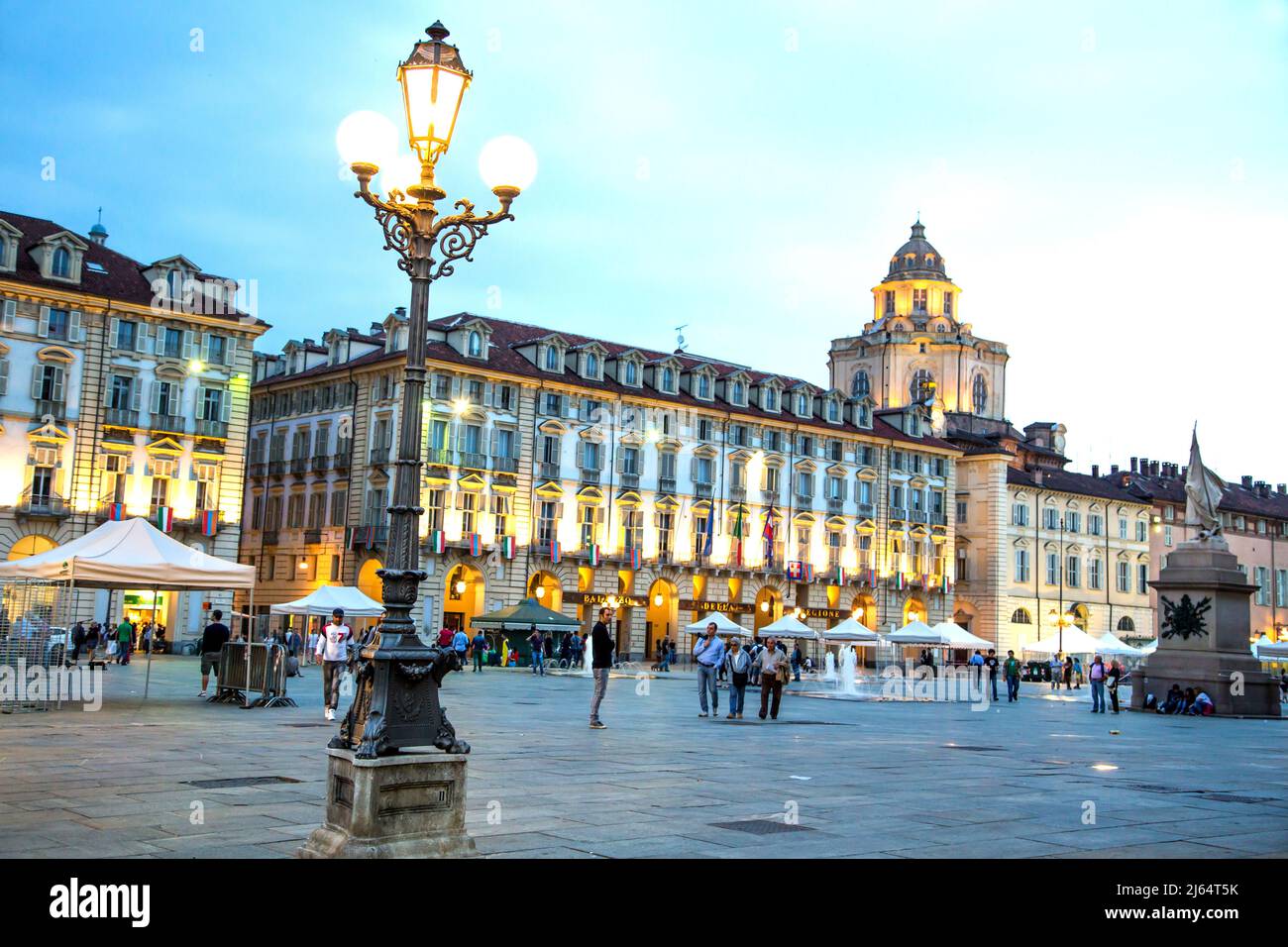 Visitors and locals taking an evening stroll around Piazza Castello in Turin Italy. Stock Photo