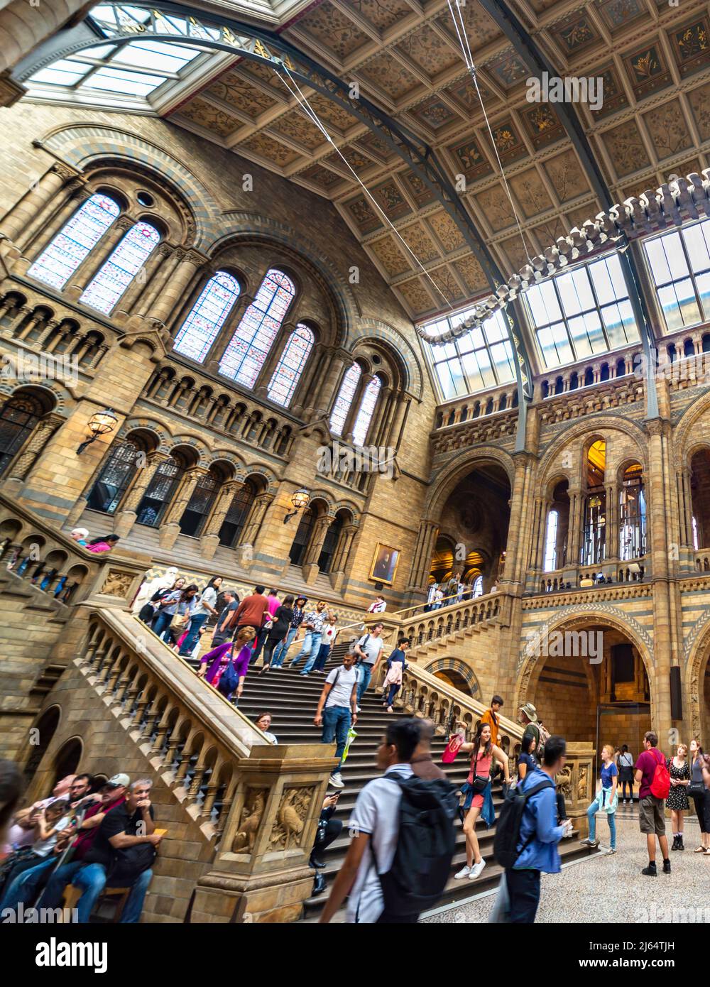London,England,UK-August 21 2019: Many visitors climb the opulent staircase at the far end of Hintz Hall,the entrance to the main body of the museum,o Stock Photo