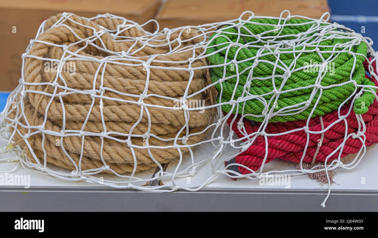 Thick Ropes in Coils Under Netting at Boat Stock Photo Alamy