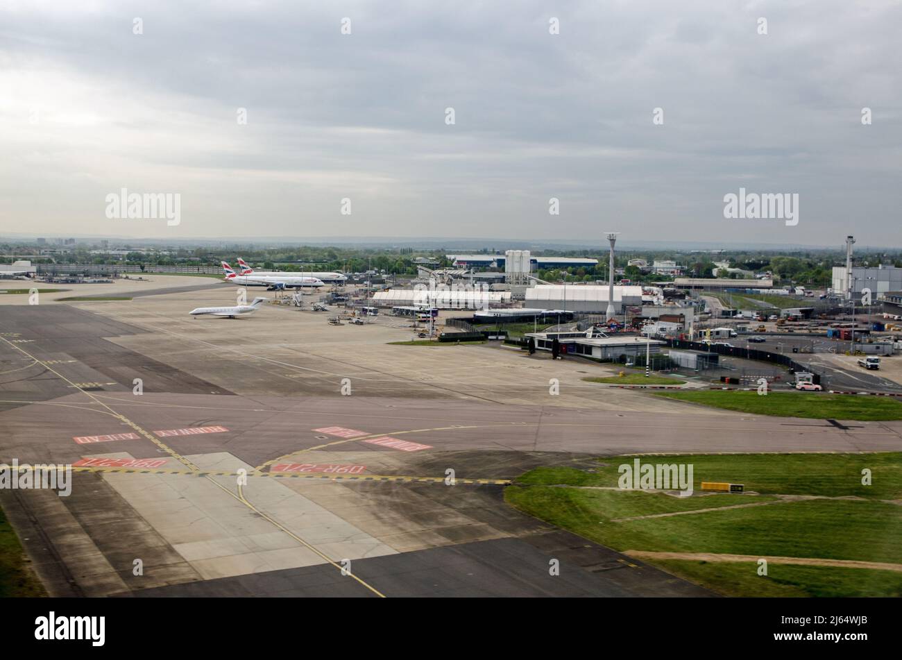 London, UK - April 19, 2022:  Aerial view of Heathrow Airport in London with the Royal Suite building towards the right hand side.  The small building Stock Photo