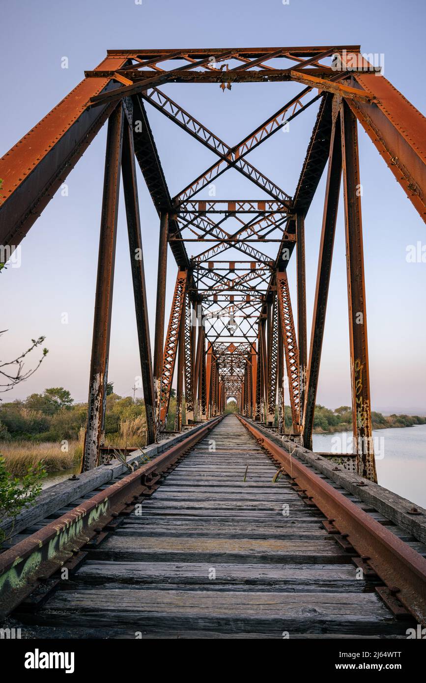 Old railroad bridge over the Salinas River outside of Marina CA Stock Photo