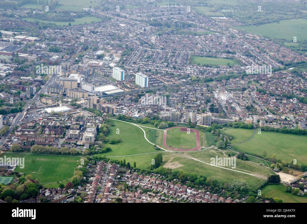 View from above of Feltham Town Centre in Hounslow, West London with the running track, part of Feltham Arenas, in the middle. Stock Photo