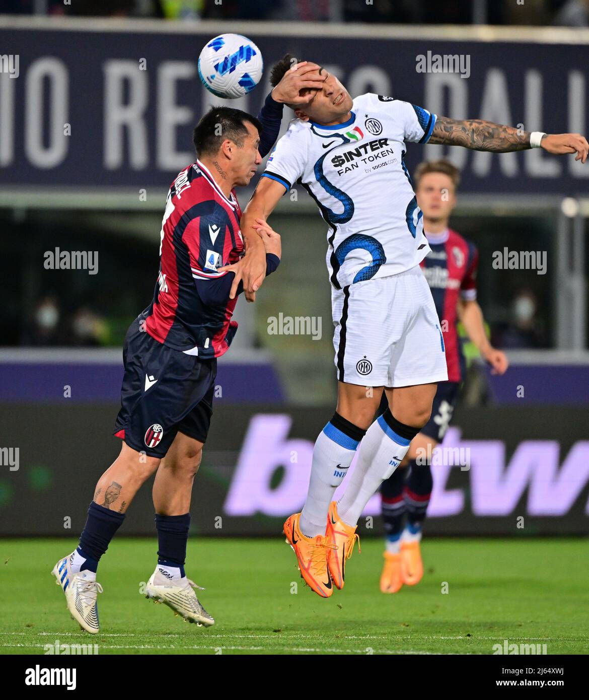 Bologna, Italy. 27th Apr, 2022. Inter Milan's Lautaro Martinez (R) vies  with Bologna's Gary Medel during their Serie A football match in Bologna,  Italy, April 27, 2022. Credit: Alberto Lingria/Xinhua/Alamy Live News