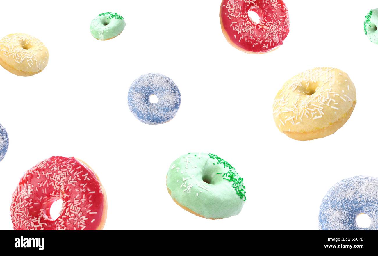 Many flying donuts isolated on white Stock Photo