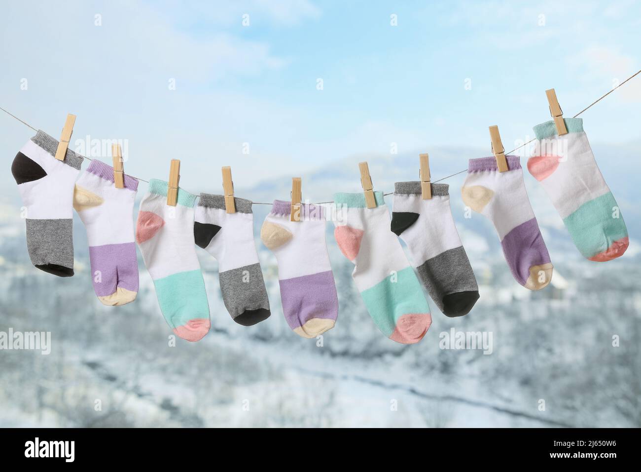Rope with clean socks outdoors on winter day Stock Photo - Alamy