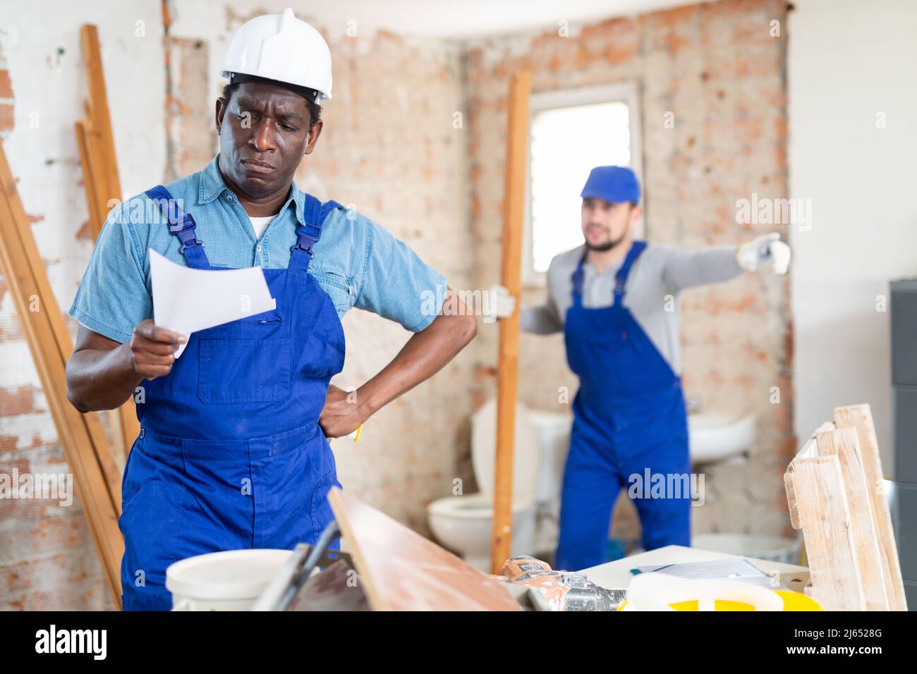 Filing Foreman Portrait of foreman examining project documentation Stock Photo - Alamy