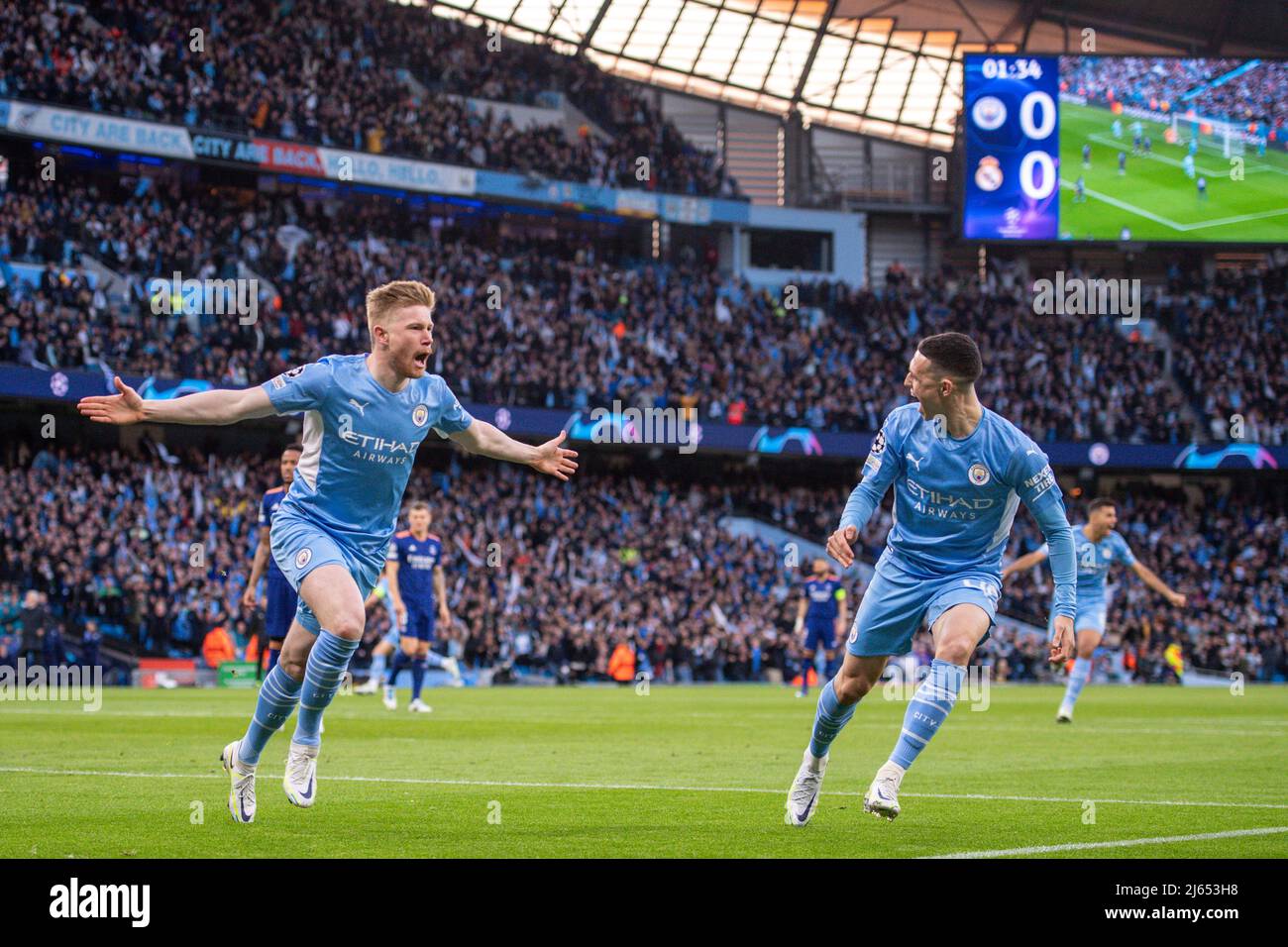 MANCHESTER, ENGLAND - APRIL 26: Kevin De Bruyne of Manchester City celebrates with Phil Foden after scoring 1st goal during the UEFA Champions League Semi Final Leg One match between Manchester City and Real Madrid at City of Manchester Stadium on April 26, 2022 in Manchester, United Kingdom. (Photo by SF) Credit: Sebo47/Alamy Live News Stock Photo