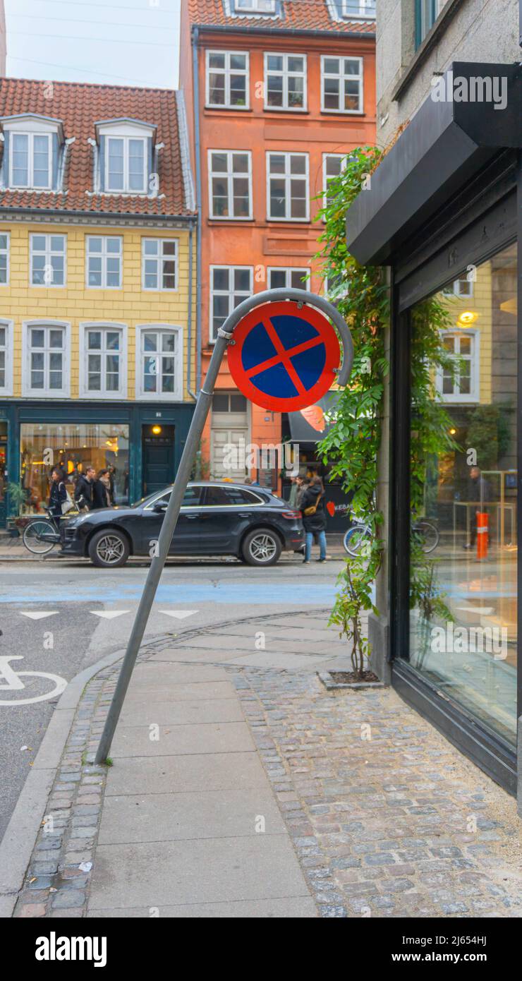 Copenhagen, Denmark November 14, 2021 A leaning road sign for