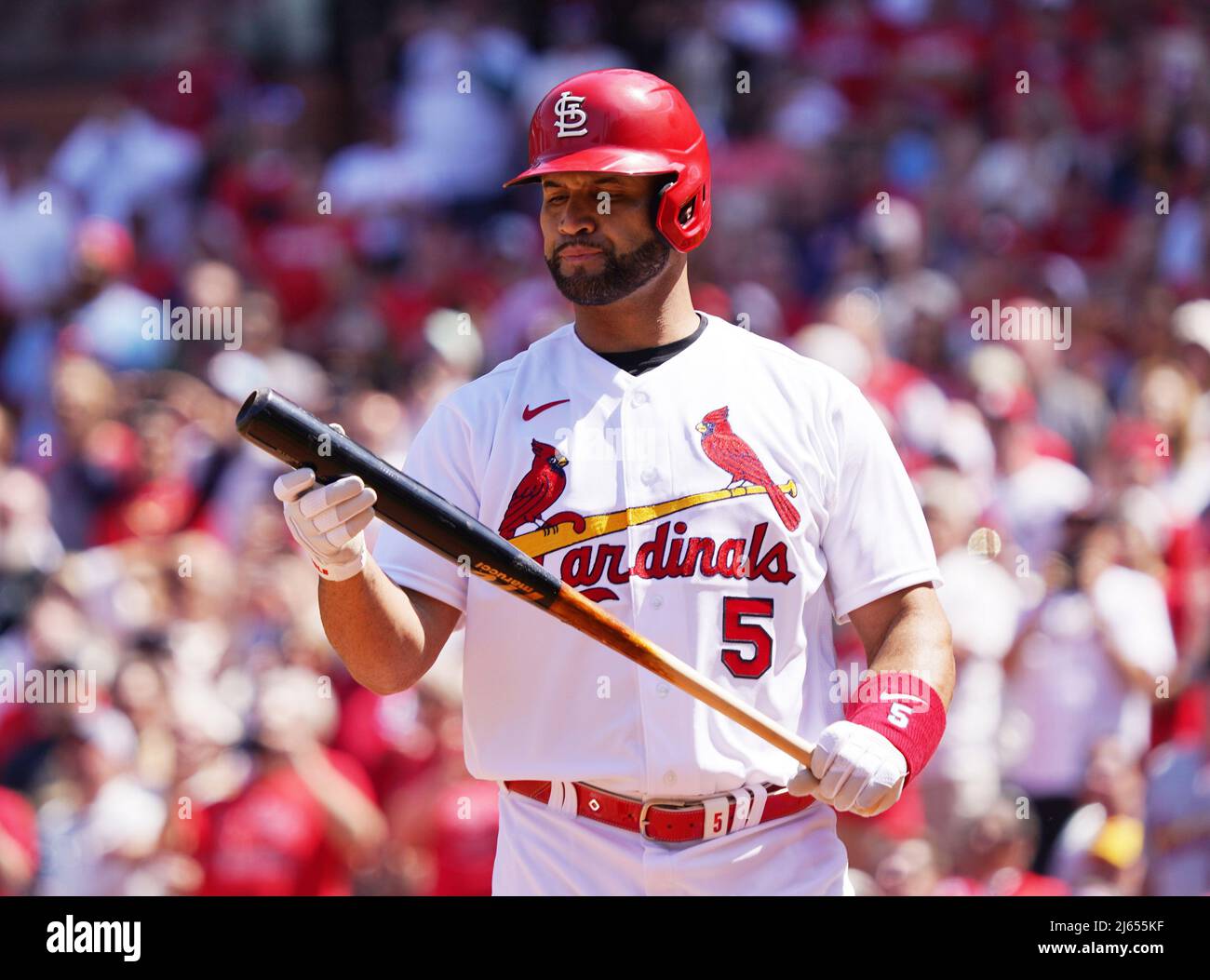 St. Louis, United States. 27th Apr, 2022. St. Louis Cardinals Albert Pujols  inspects his bat as he bats in the sixth inning against the New York Mets  at Busch Stadium in St.