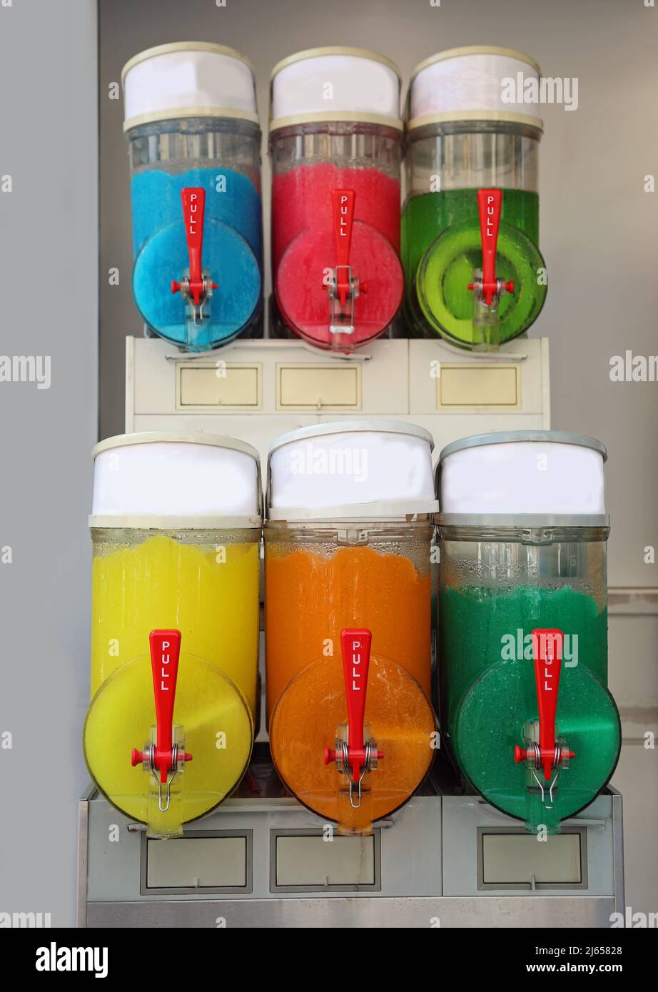 iced grenadine dispenser with flavors of many types for sale in the outdoor kiosk Stock Photo