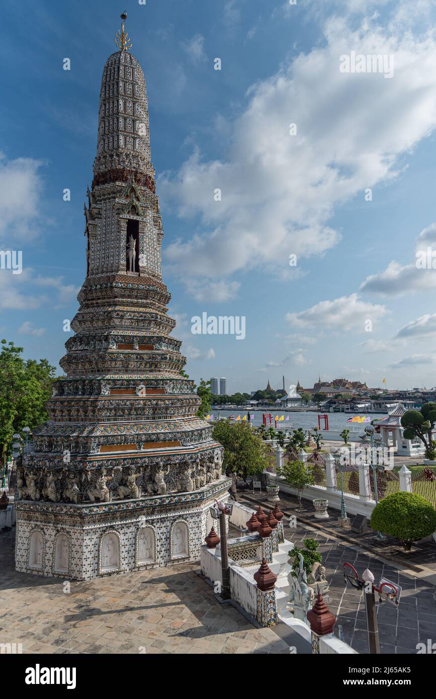 Wat Arun white pagoda with Chao Phraya River and Royal Palace view. Bangkok, Thailand. Stock Photo