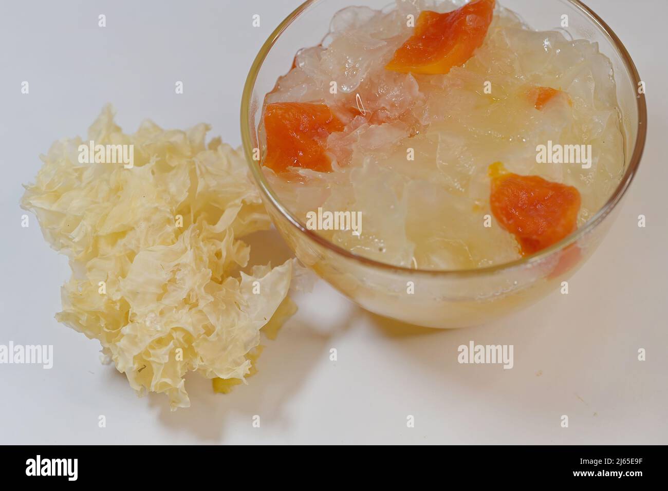 Dessert soup of double boiled snow or white fungus with papaya in glass