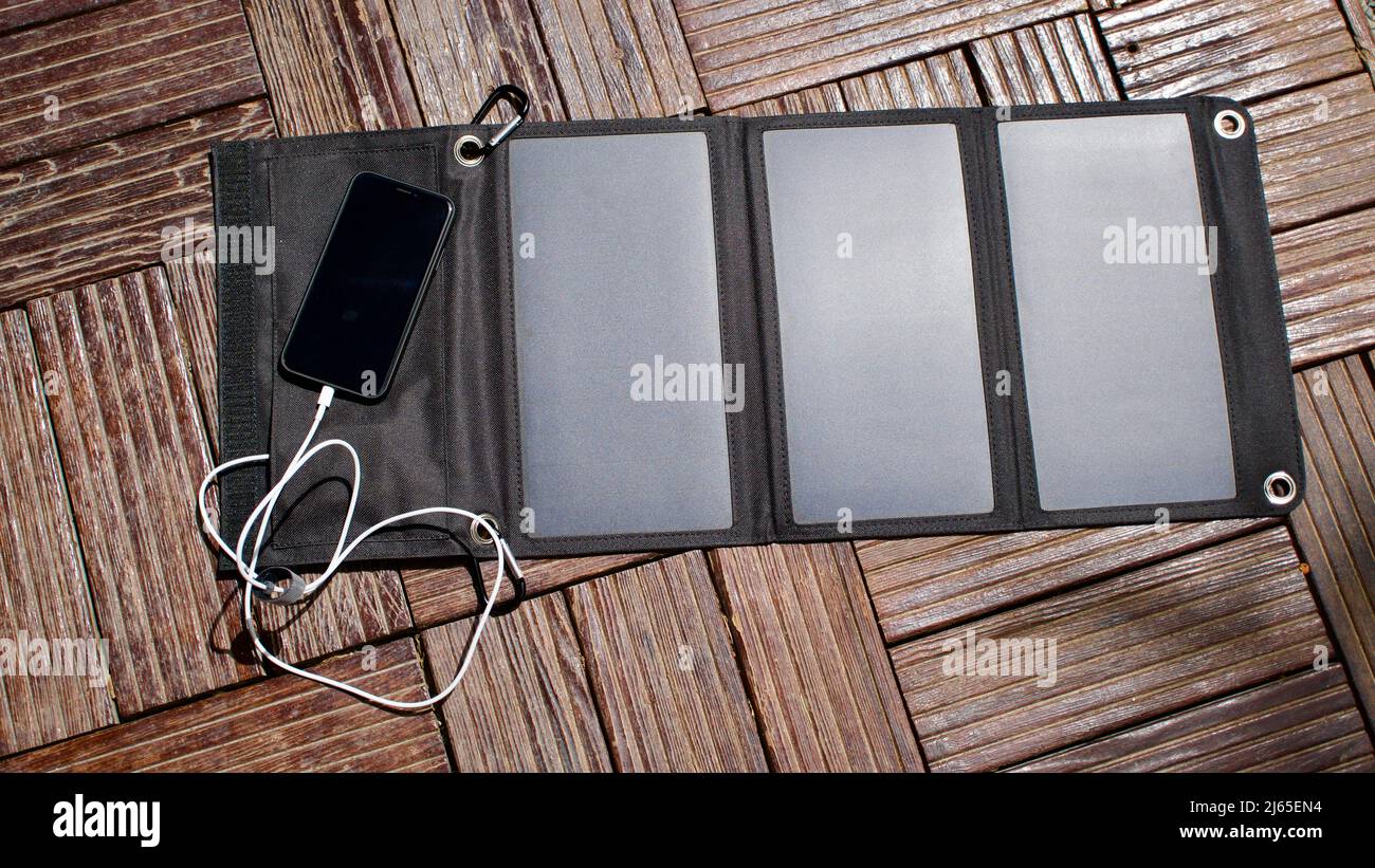 Charging mobile phone with solar energy. Phone charging using solar