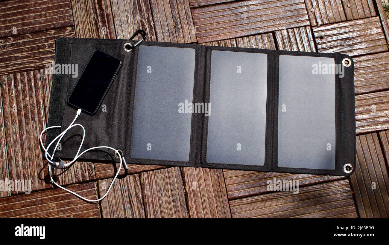 Charging mobile phone with solar energy. Phone charging using solar
