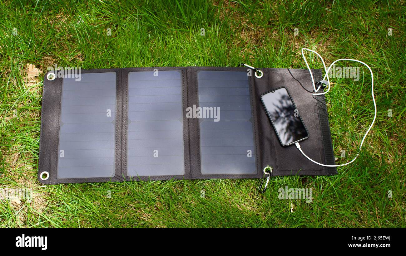 Charging mobile phone with solar energy. Phone charging using solar