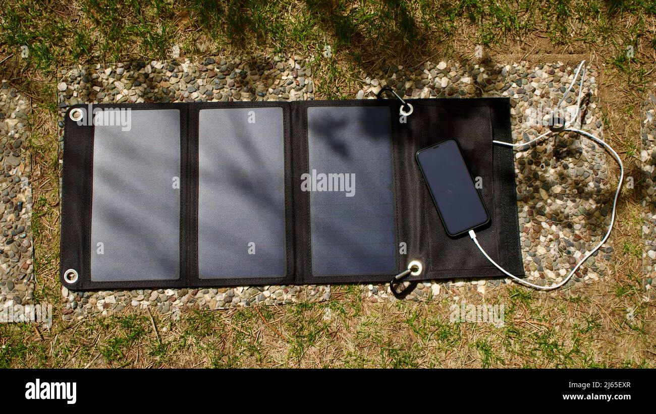 Charging mobile phone with solar energy. Phone charging using solar