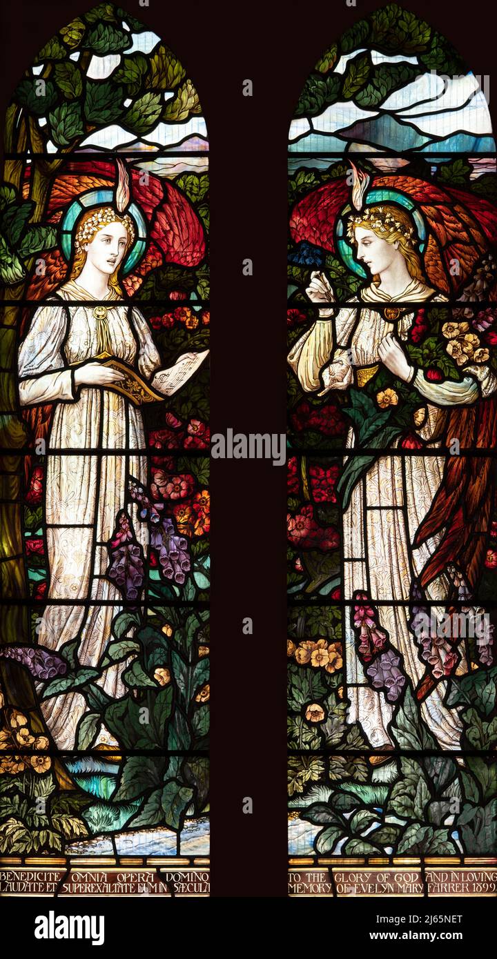 Winged angels in a flower garden by William Aikman (1899), All Saints Church, Watermillock, Cumbria, UK Stock Photo