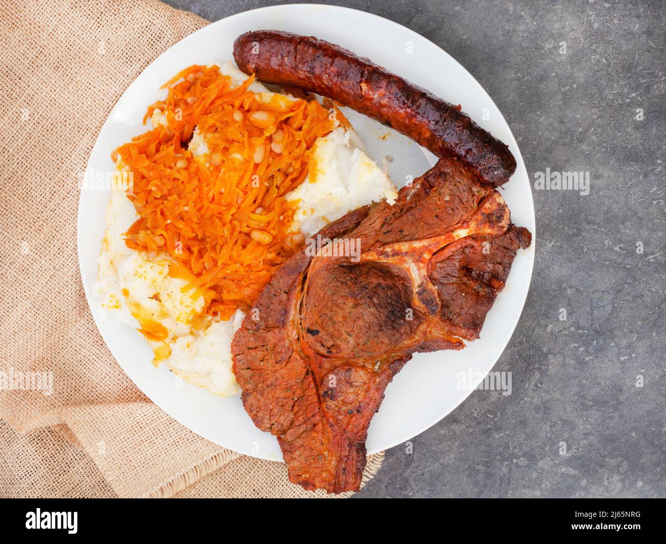 Flat lay of Traditional South African Braai or Shisa nyama, meat cooked