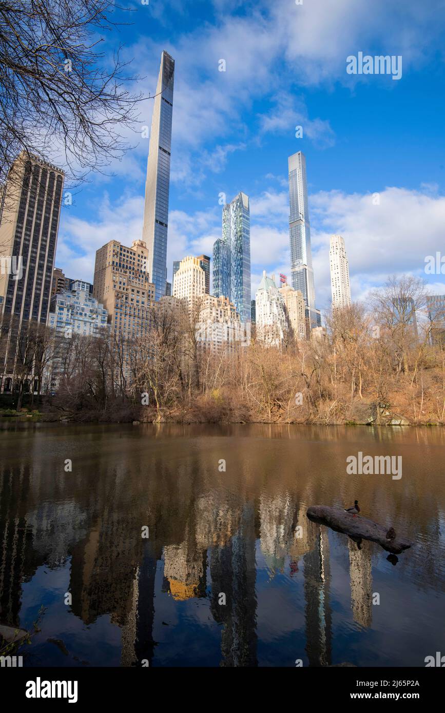 Skyscrapers reflected in The Pond in Central Park in Manhattan New York City, USA Stock Photo