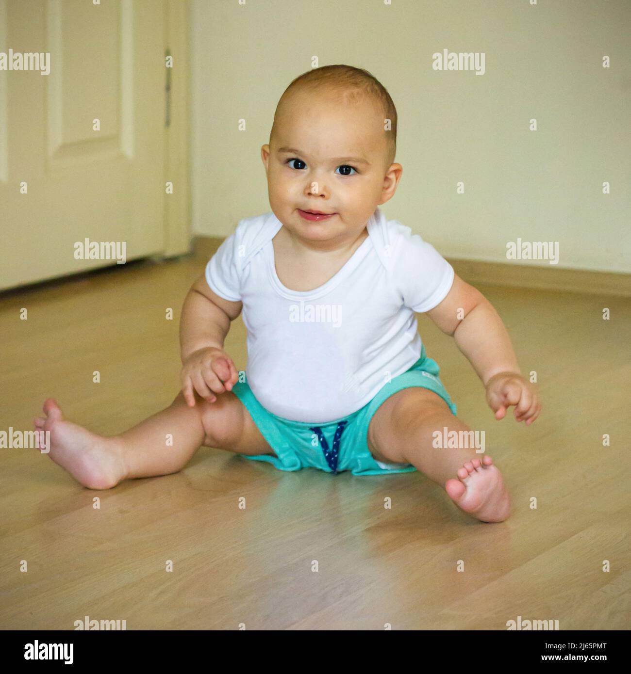 Sweet chubby baby on the floor. Baby boy at home Stock Photo Alamy