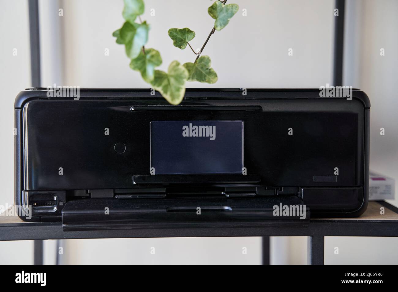 Black inkjet printer is on the shelf Stock Photo