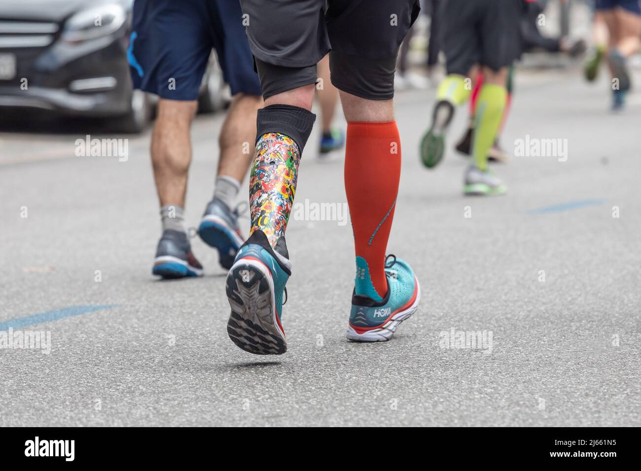 runner with lower leg prosthesis at marathon Stock Photo