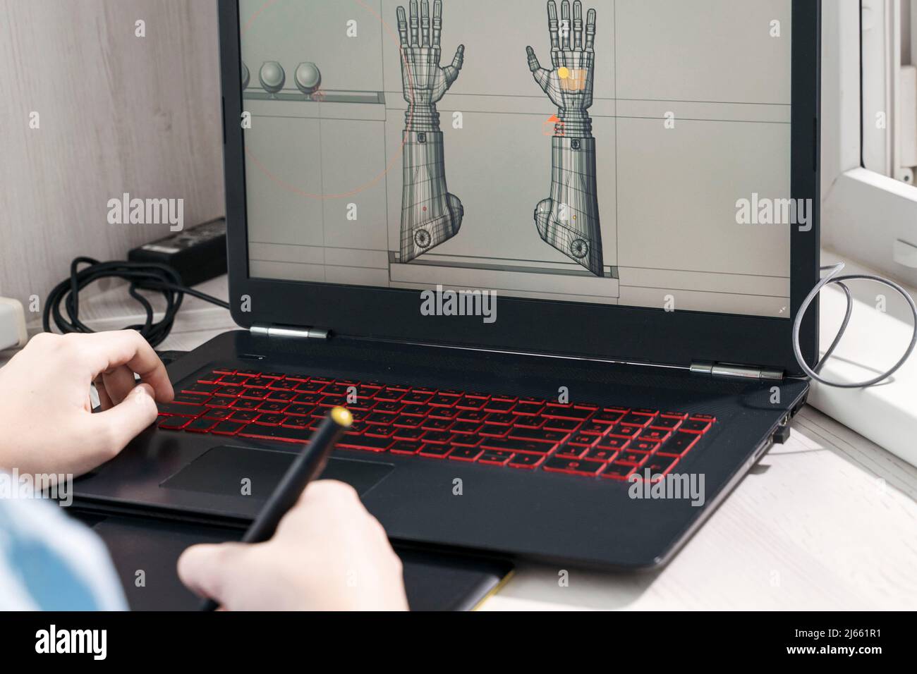digital artist working on 3d graphics using a graphics tablet. Stock Photo