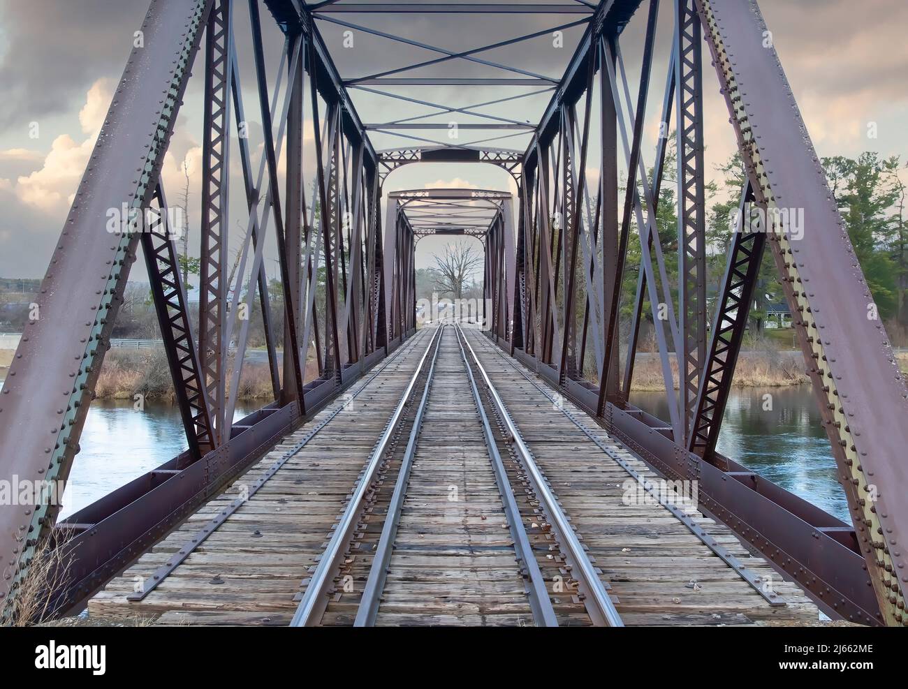 Old iron railway truss bridge built in 1893 crossing the Mississippi river in spring in Galetta, Ontario, Canada Stock Photo