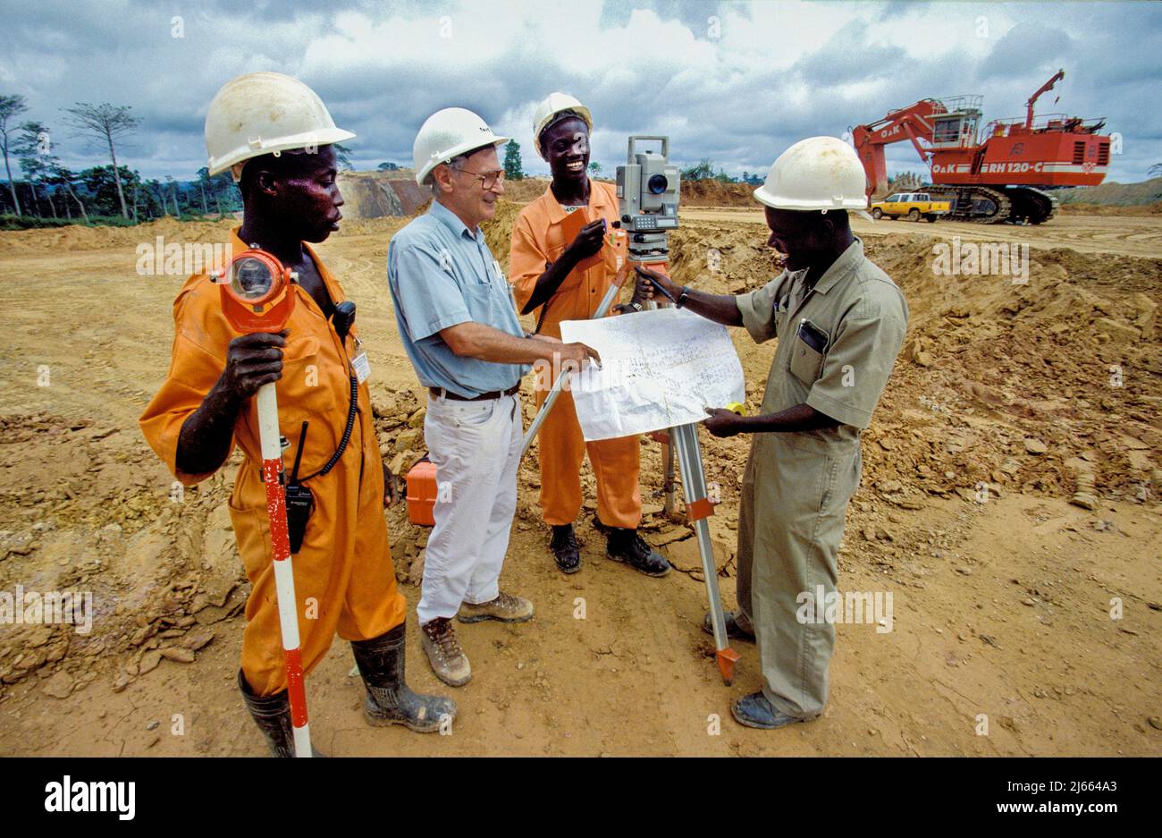 Ghana, Kumasi region; workers surveying at a construction site Stock