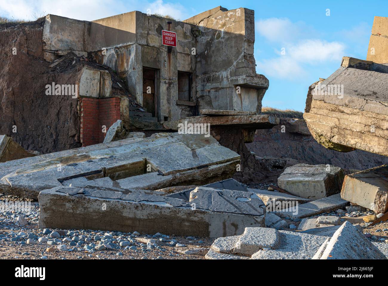 Wrecked coastal fortifications on the beach at Easington near Spurn Head Stock Photo