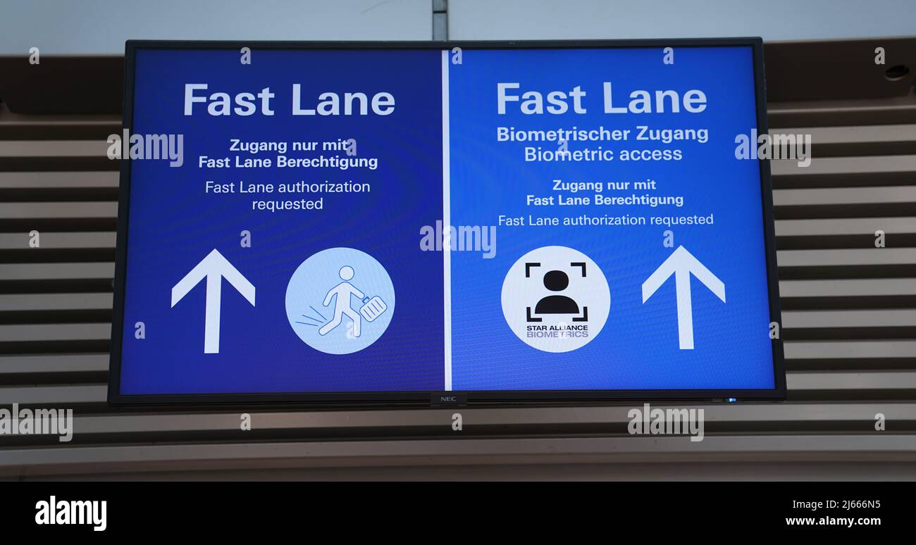 Hamburg, Germany. 28th Apr, 2022. Signs reading "Fast Lane" point the way  to biometric facial recognition at the security checkpoint in the departure  area of Hamburg Airport. The new service is available