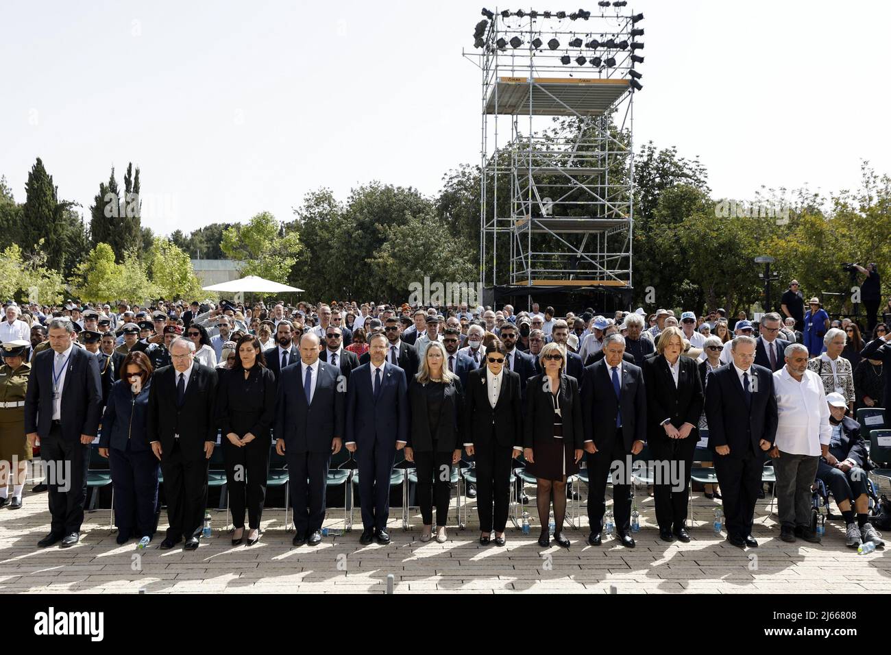 Jerusalem, Israel. 28th Apr, 2022. Israeli Prime Minister Naftali Bennett and President Isaac Herzog stand still together with other officials during the ceremony marking Holocaust Remembrance Day at Warsaw Ghetto Square at Yad Vashem memorial in Jerusalem, April 28, 2022. REUTERS/ Amir Cohen/ POOL Credit: UPI/Alamy Live News Stock Photo